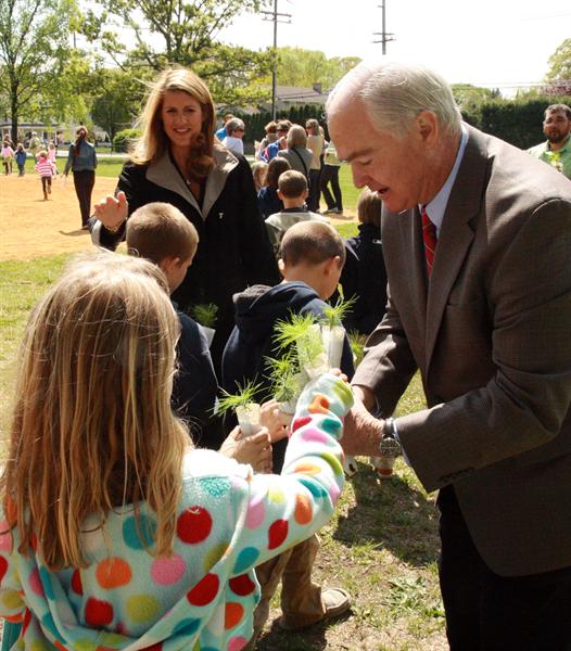 As part of the Monmouth County's 2012 Arbor Day celebration at Sea Girt School, Freeholder Director John P. Curley (in foreground) hands out white pine seedlings to students as Freeholder Serena DiMaso looks on. 